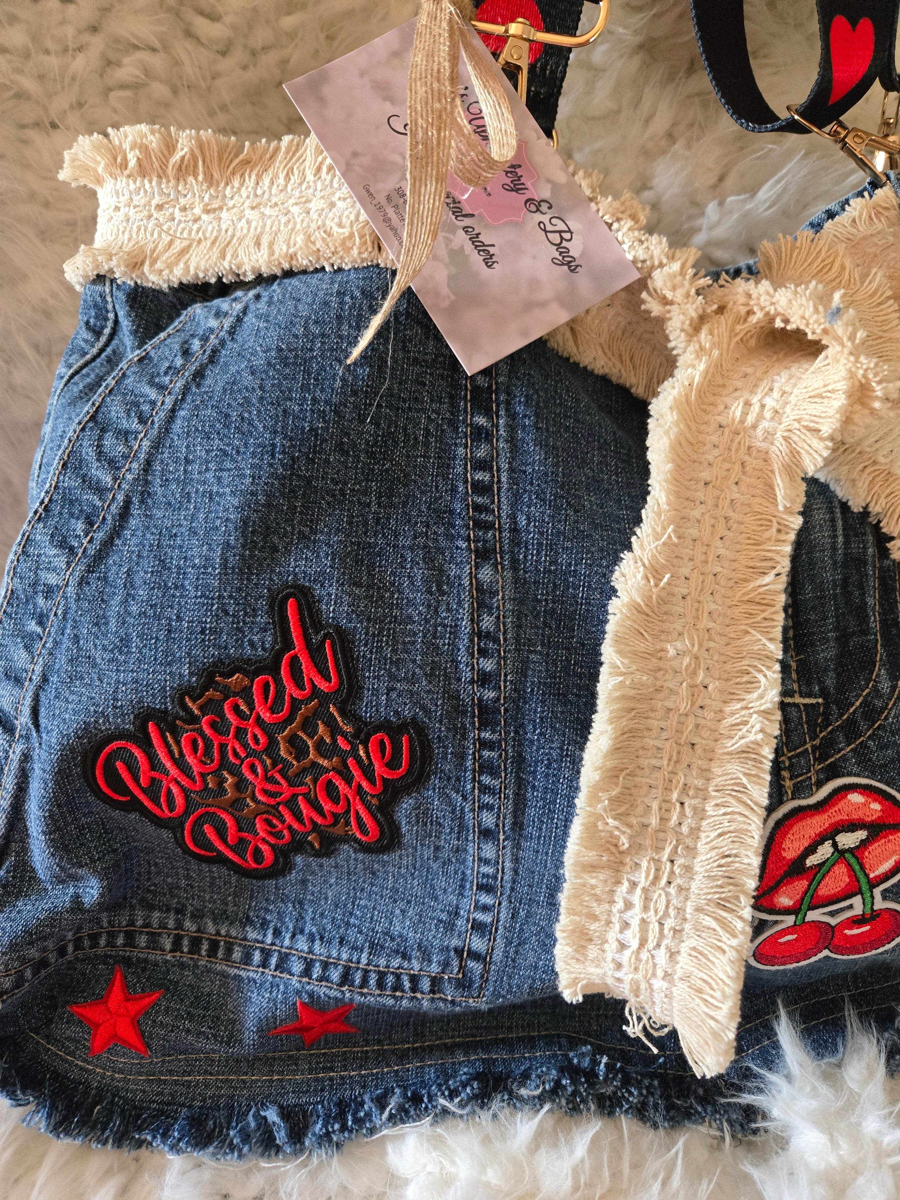 Handmade jean purse with lots of pockets on the outside with lots of red