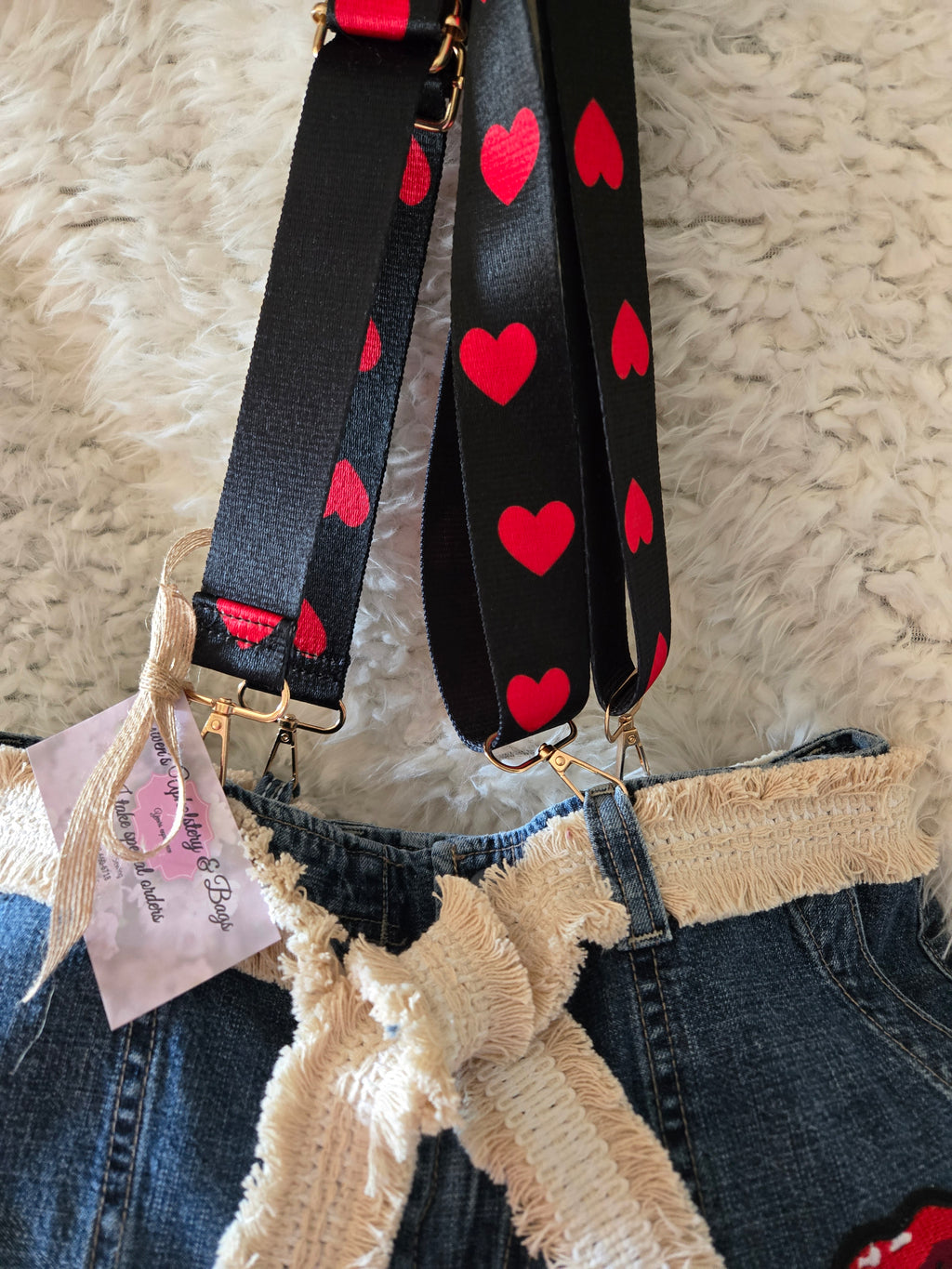 Handmade jean purse with lots of pockets on the outside with lots of red