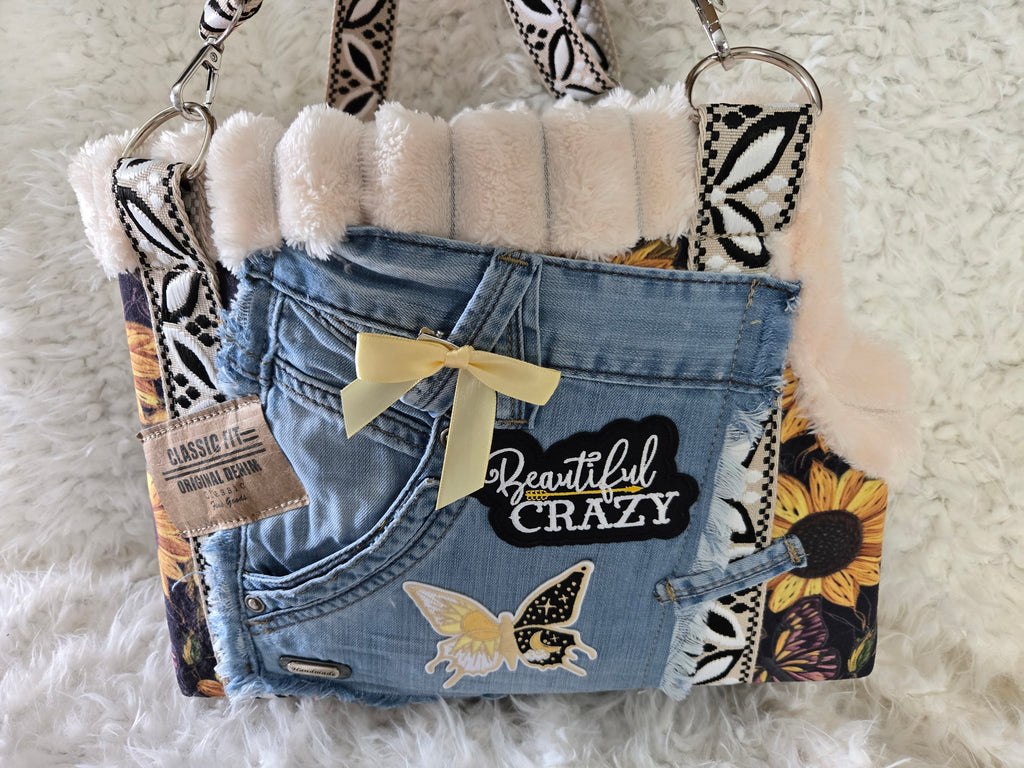 Medium to large dog carrier with sunflowers on fake Fur and Jean pockets. Manny pocket with crossbody straps, handmade in the USA