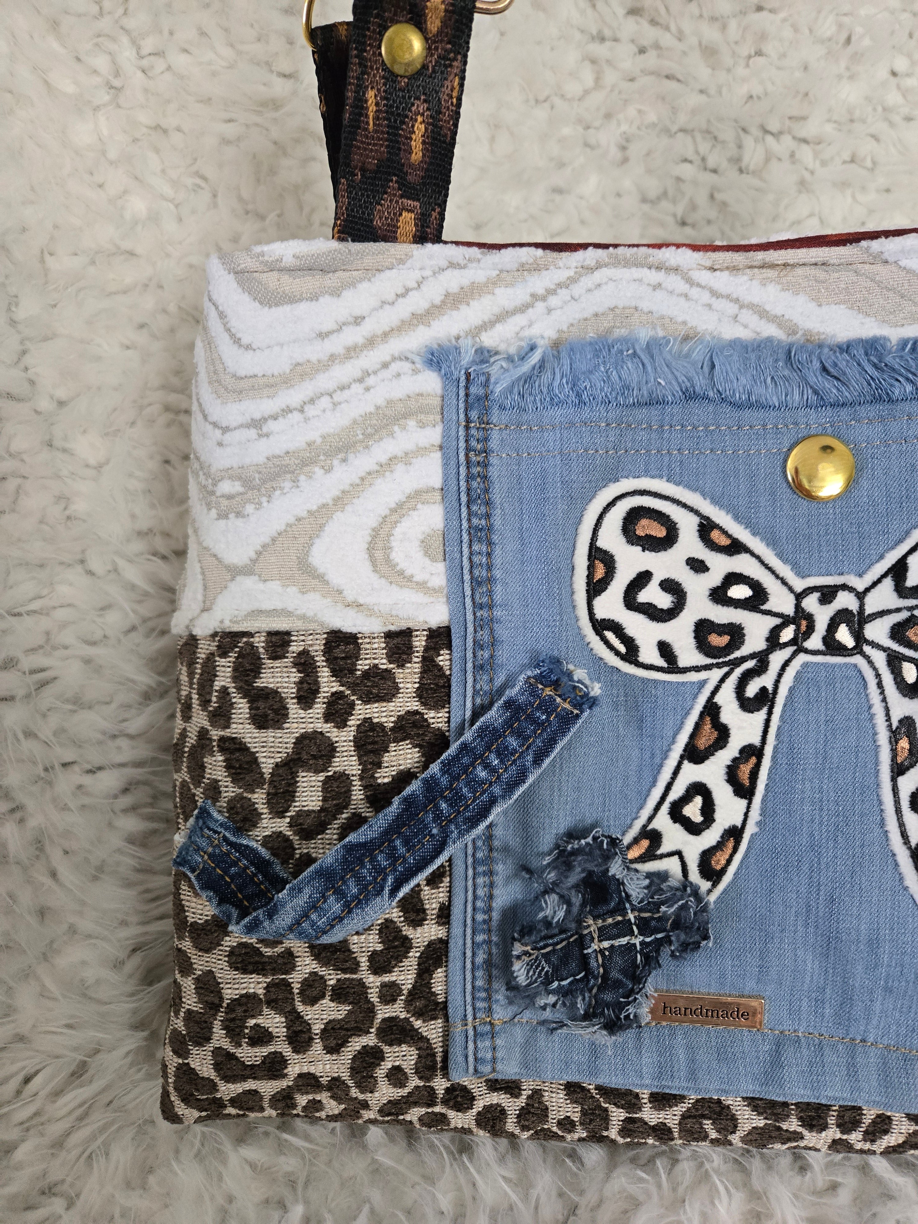 Cheetah and Jean purse handbag. So I say, size 16, / 12.