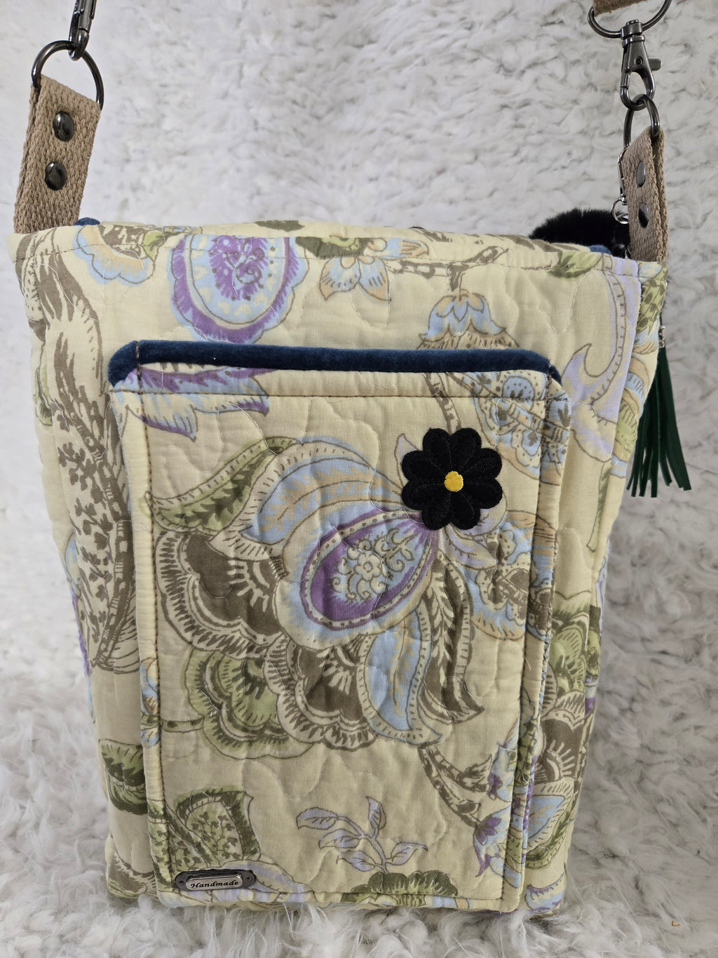 Medium size purse quilted with embroidered dragonfly. On the front with 2 pockets, 1 inside 1 outside yellows and greens and blues. 10x14 crossbody